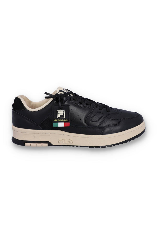 A black FILA low basketball trainer with lace-up closure and the FILA logo on the side.
