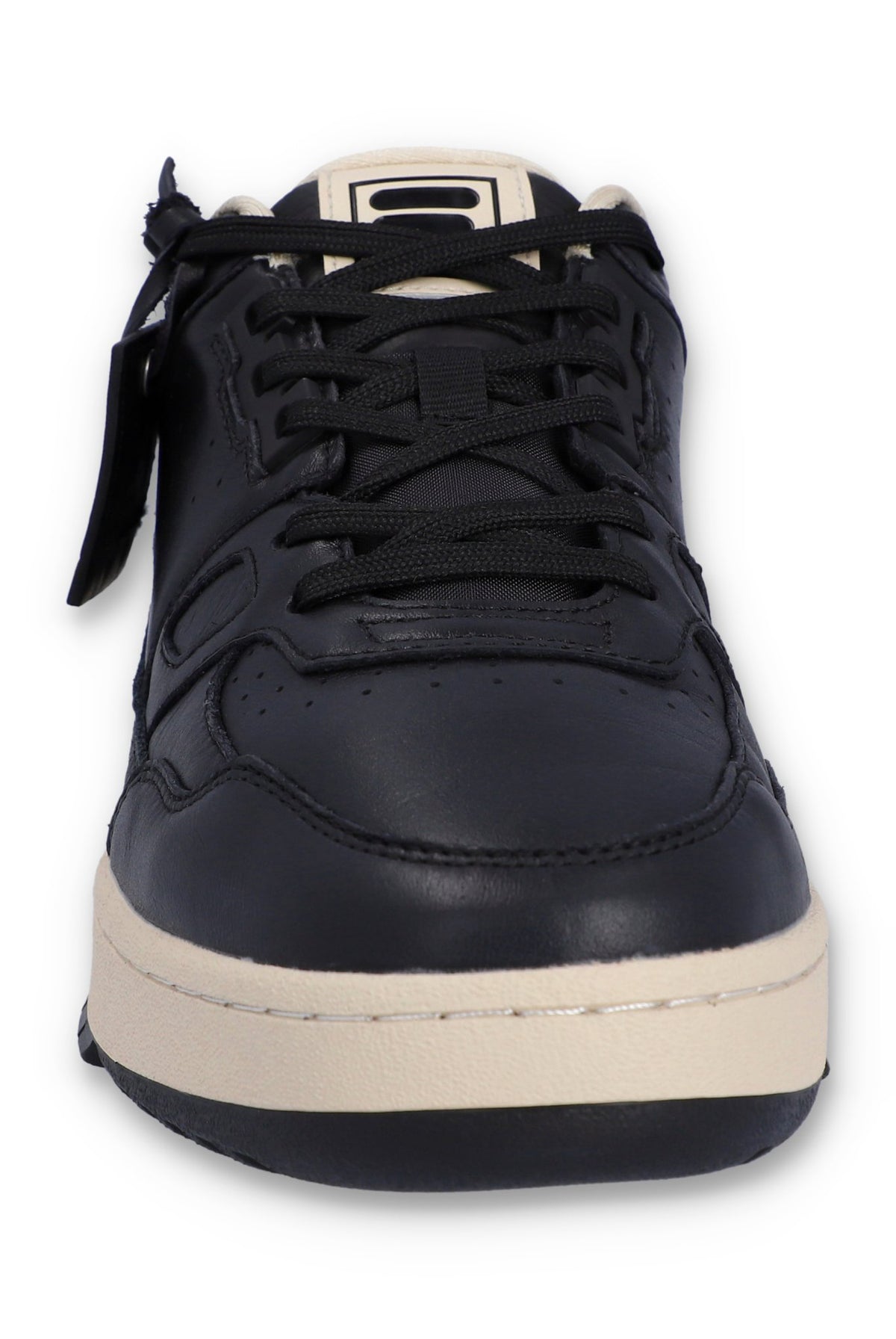 A black FILA low basketball trainer with lace-up closure and the FILA logo on the tongue.