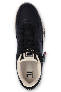 A black FILA low basketball trainer with lace-up closure and the FILA logo on the tongue and insole.