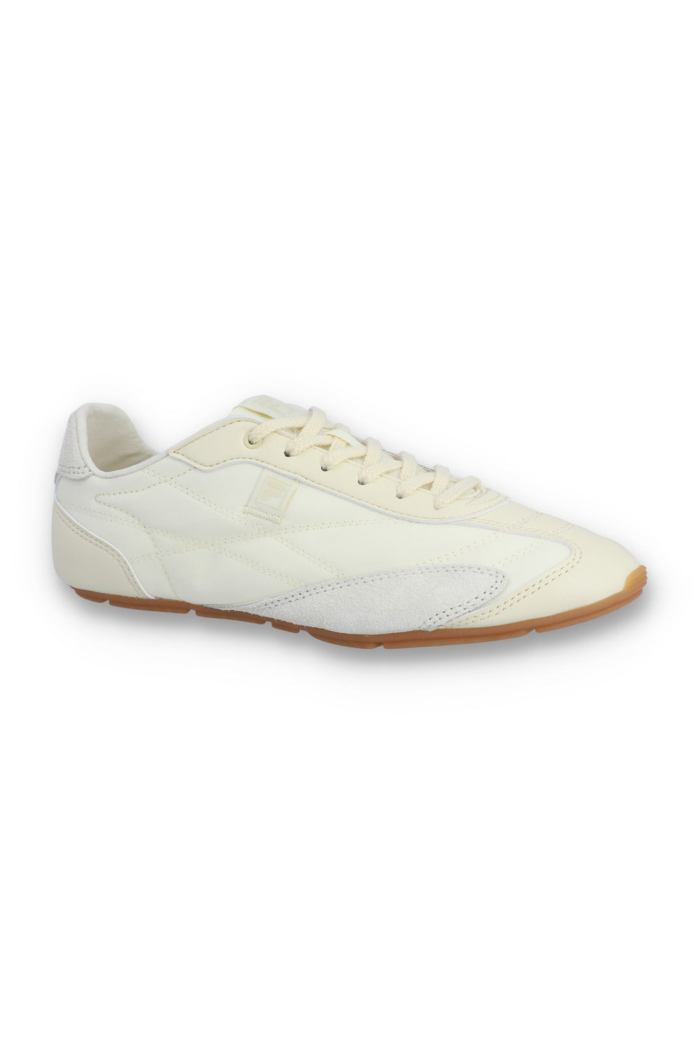 Profile view of a FILA Ritmo trainer in off-white nylon and suede, featuring a low-profile silhouette, tonal laces, an embroidered 'F' logo on the side panel, and a slim brown rubber sole against a white background.