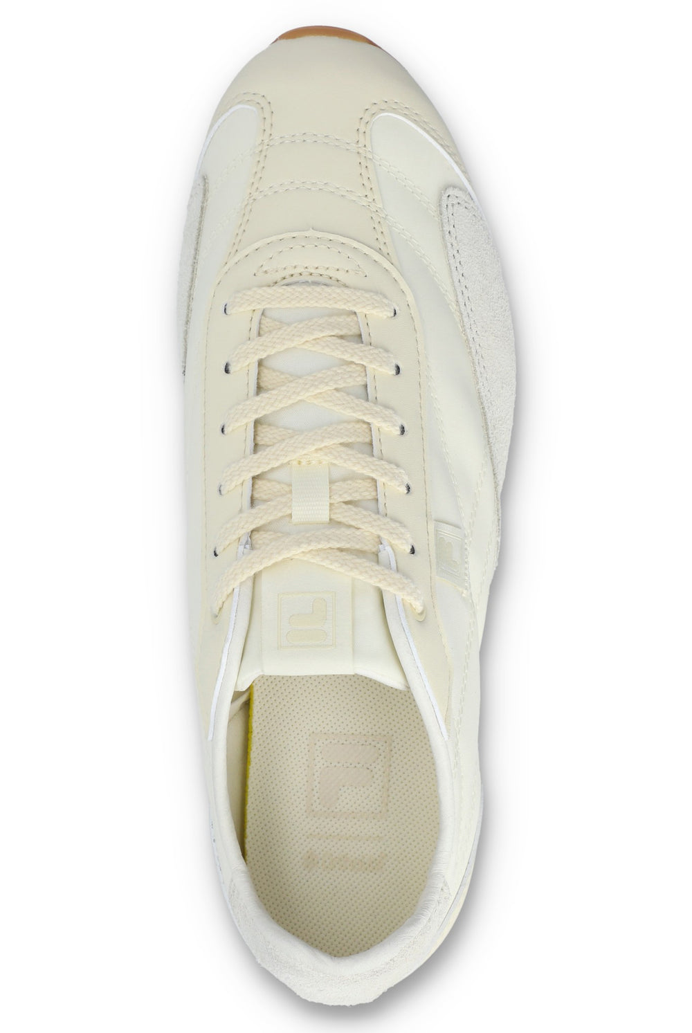 Overhead view of a FILA Ritmo trainer in off-white nylon, showing the flat tonal laces, tongue branding, and a textured cream insole with a subtle logo against a white background.