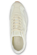 Overhead view of a FILA Ritmo trainer in off-white nylon, showing the flat tonal laces, tongue branding, and a textured cream insole with a subtle logo against a white background.