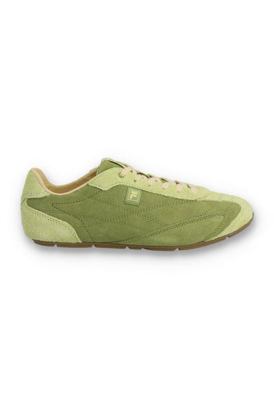 Profile view of a FILA Ritmo trainer in sage green suede, featuring a low-profile silhouette, cream laces, a light green embossed 'F' logo on the side panel, and a slim brown rubber sole against a white background.