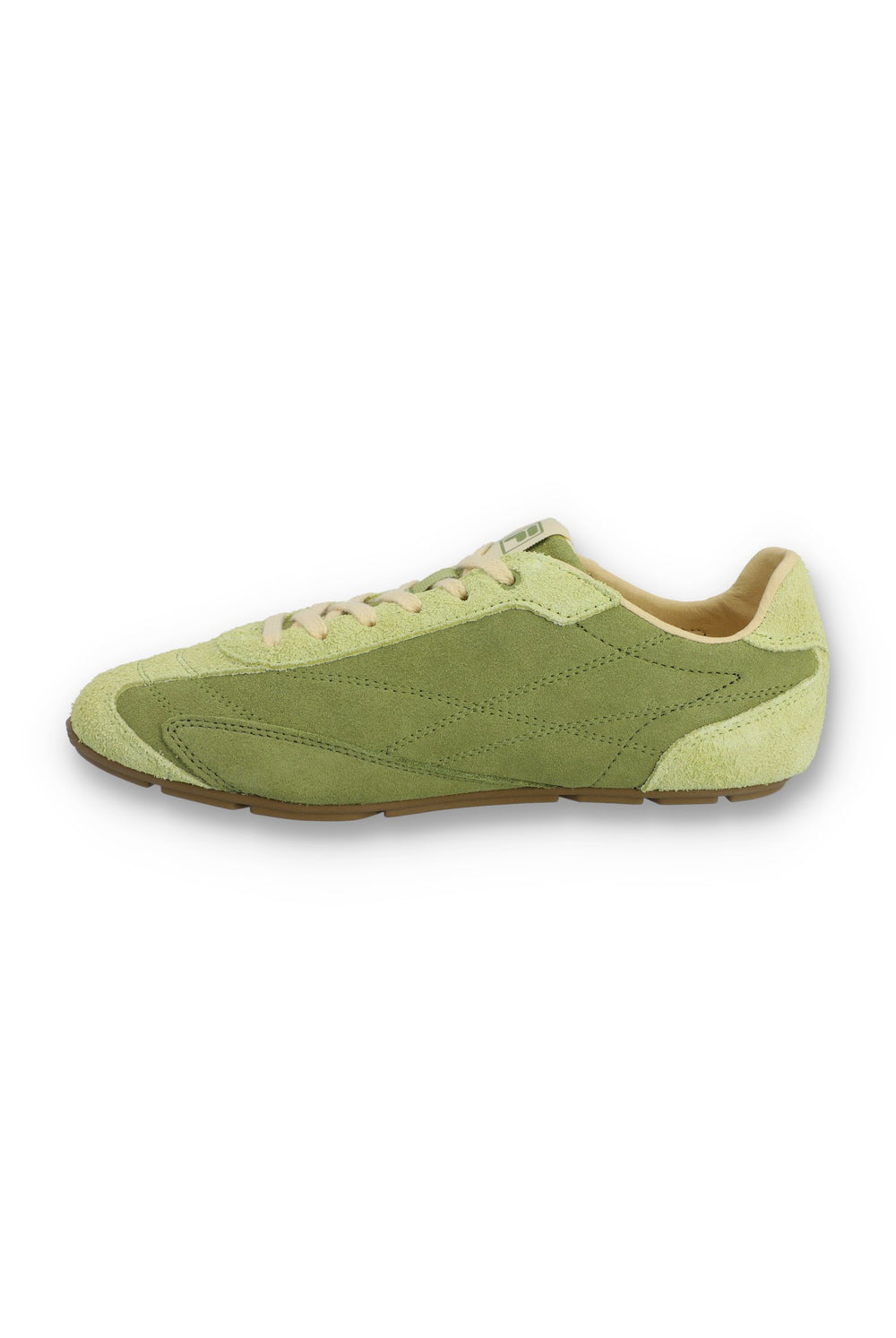 Medial profile view of a FILA Ritmo trainer in green suede, showing the unbranded inner side panel with tonal stitching, contrasting pale green overlays, cream laces, and a slim brown rubber sole against a white background.