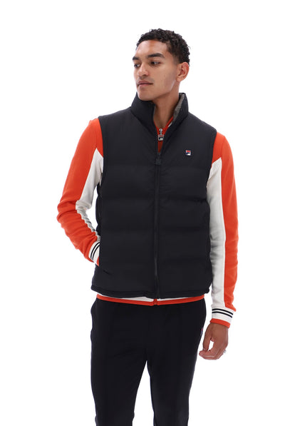 Displays a model wearing the Black/ Gunmetal 'FILA' branded Rodri Gilet