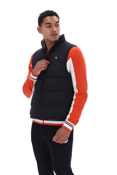 Displays a model wearing the Black/ Gunmetal 'FILA' branded Rodri Gilet