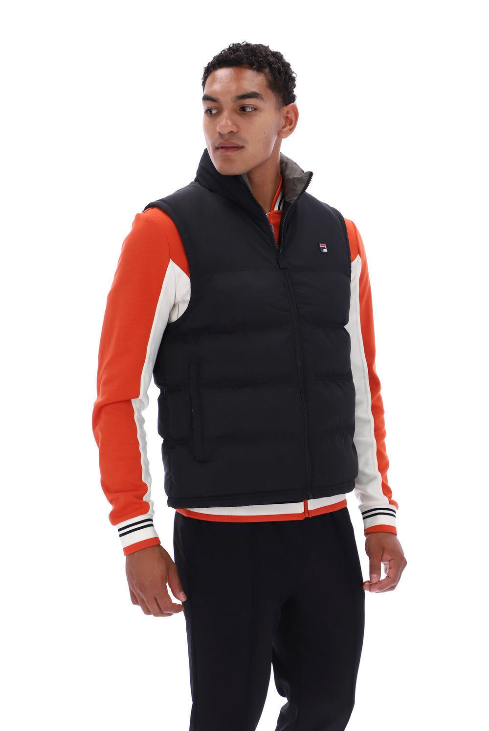 Displays a model wearing the Black/ Gunmetal 'FILA' branded Rodri Gilet