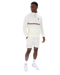 Displays a model wearing the Gardenia 'FILA' branded Rolando 1/4 Zip Neck Sweatshirt