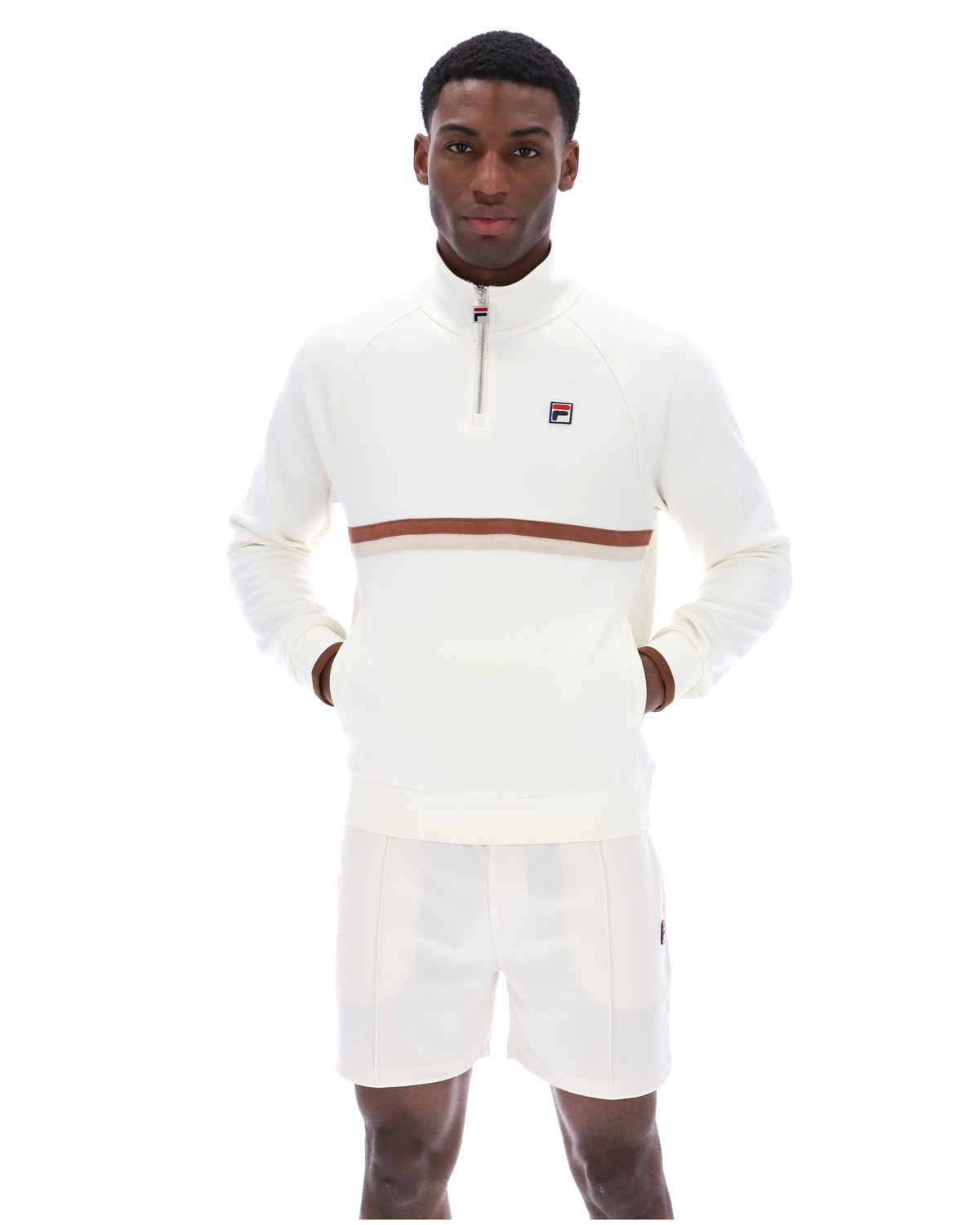 Displays a model wearing the Gardenia 'FILA' branded Rolando 1/4 Zip Neck Sweatshirt