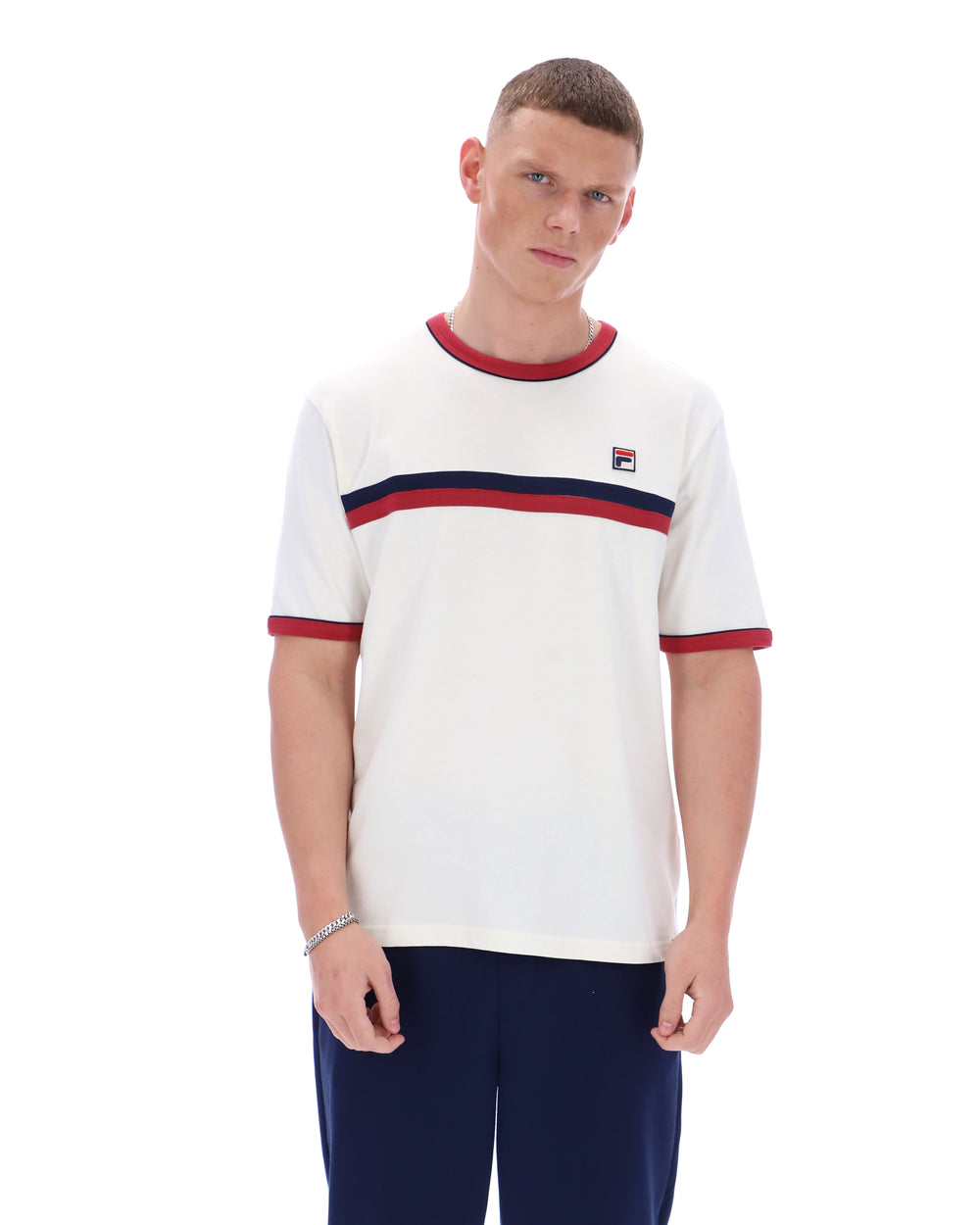 Man wearing a white t-shirt with red and blue stripes and a logo on a white background