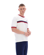 Man wearing a white sports jersey with red and blue stripes on a white background