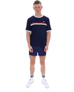 Man wearing a navy blue t-shirt with a red and white stripe and matching shorts on a white background