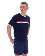 Man wearing a navy tracksuit with a red and white stripe on a white background