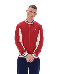 Man wearing a red and white tracksuit with a logo on a white background