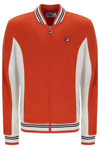 A Fila orange zip-up track jacket with white color-blocked sleeves and collar, featuring black and white striped ribbing on the collar, hem, and cuffs.