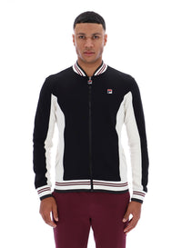 Man wearing a black and white jacket with a visible brand logo on a white background