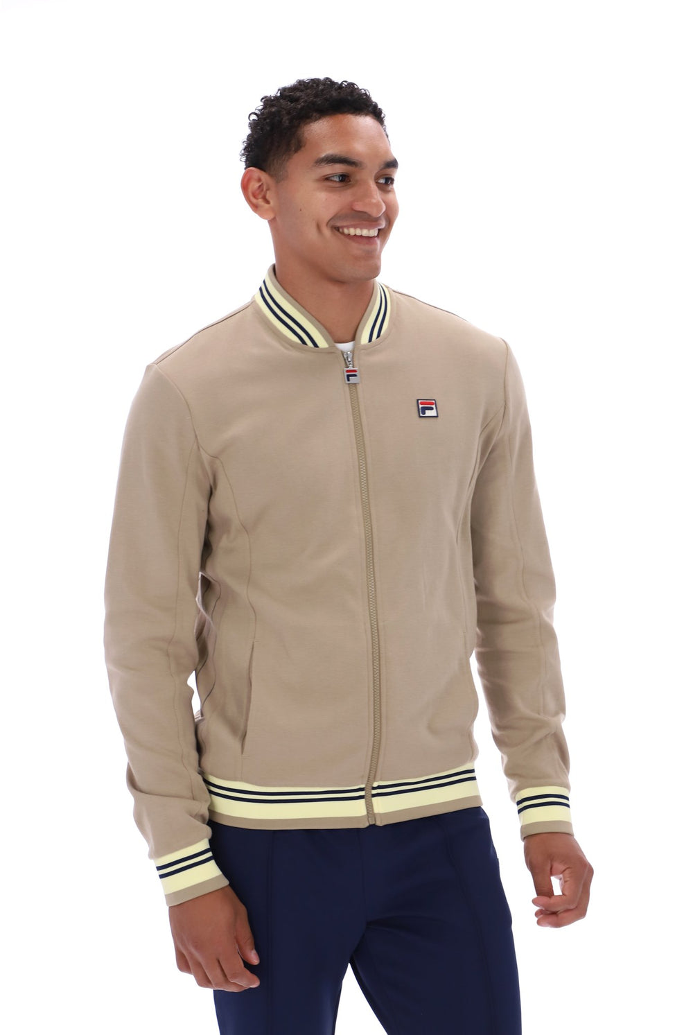 Displays a model wearing the Chinchilla Double Cream 'Fila' branded Navy Settanta Baseball Track Top