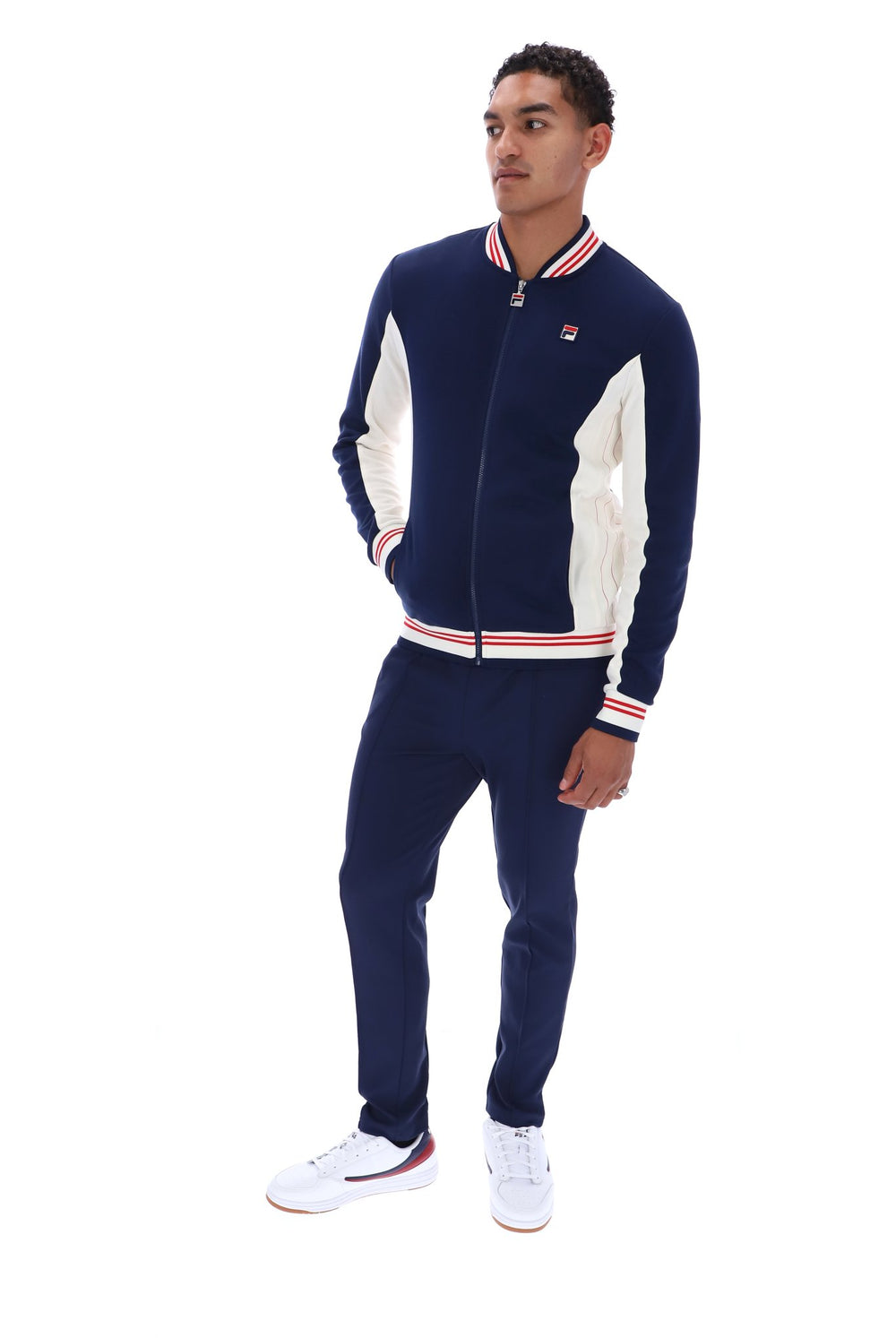 Displays a model wearing the Peacoat 'FILA' branded Settanta Baseball Track Top