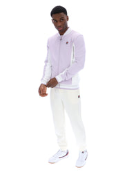 Displays a model wearing the Misty Lilac 'FILA' branded Settanta Baseball Track Top
