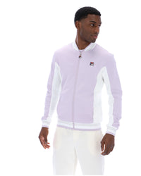 Displays a model wearing the Misty Lilac 'FILA' branded Settanta Baseball Track Top