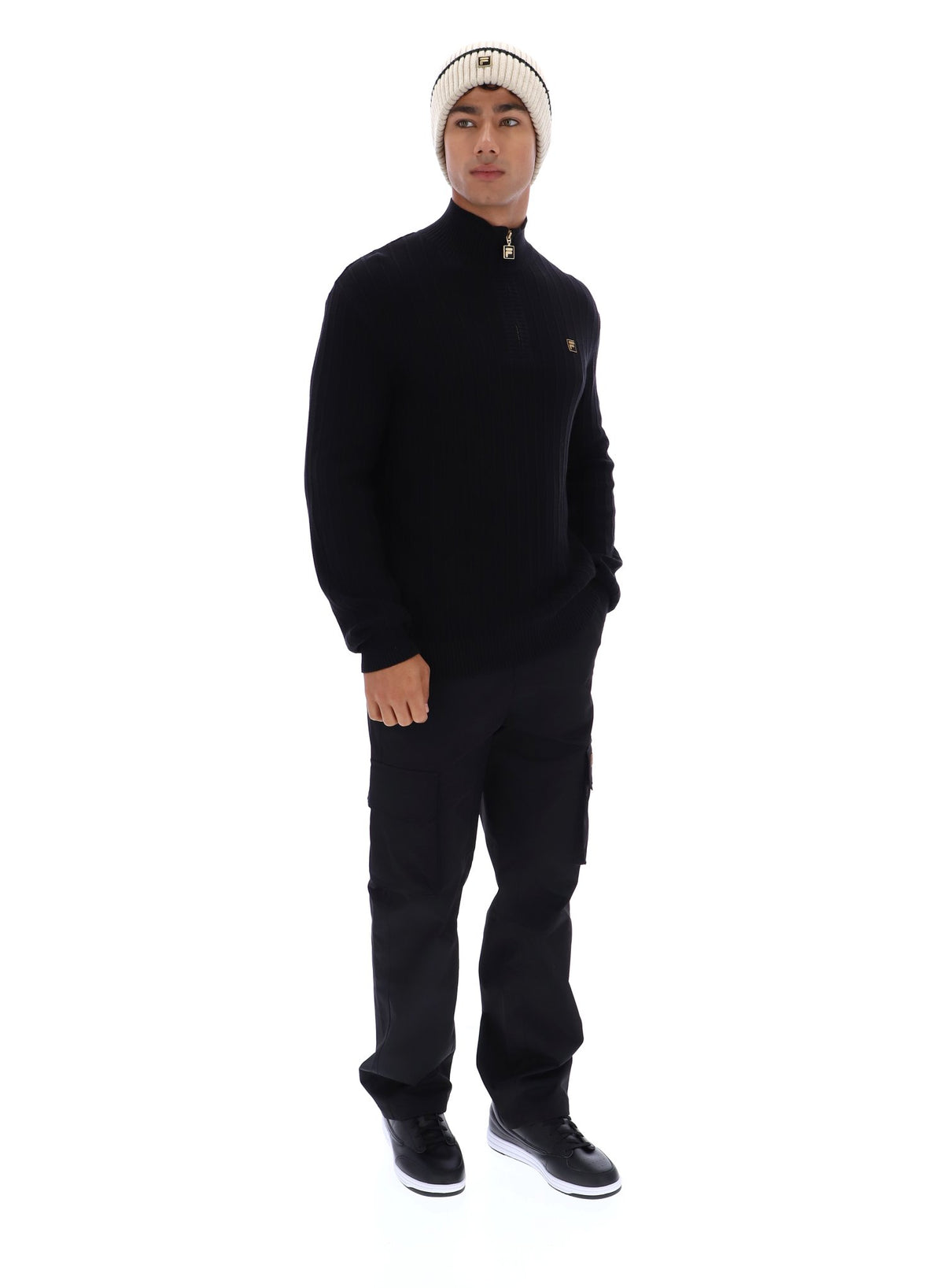 Displays a model wearing the Black 'FILA' branded Stevie 1/4 Zip Funnel Neck Textured Knit