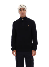 Displays a model wearing the Black 'FILA' branded Stevie 1/4 Zip Funnel Neck Textured Knit