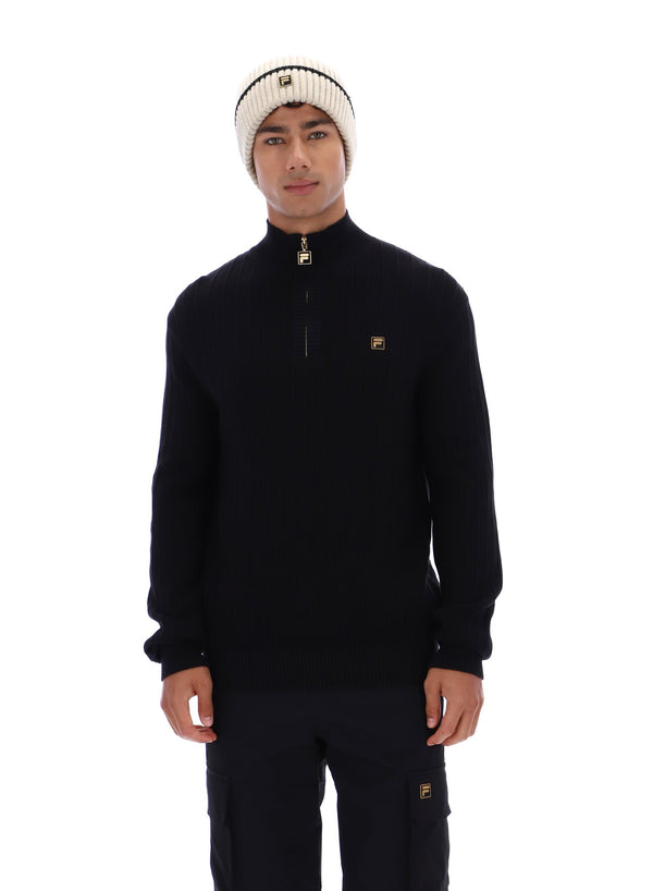 Displays a model wearing the Black 'FILA' branded Stevie 1/4 Zip Funnel Neck Textured Knit