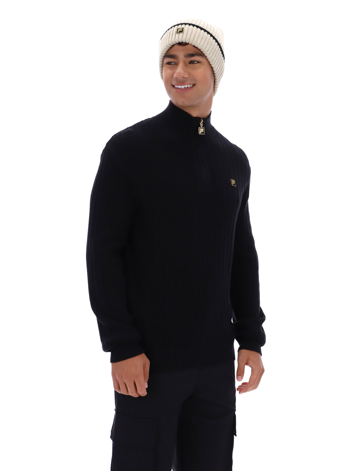 Displays a model wearing the Black 'FILA' branded Stevie 1/4 Zip Funnel Neck Textured Knit