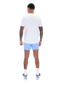 Person wearing a white t-shirt and light blue shorts on a white background
