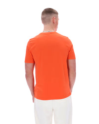 Man wearing an orange t-shirt on a white background