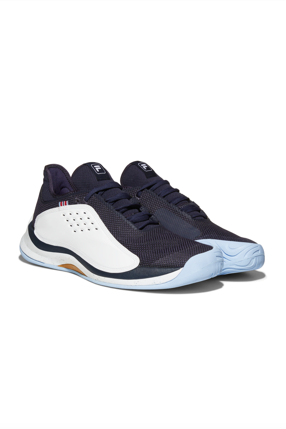 A pair of FILA Mondo Forza Tennis Trainers in white and navy colour scheme.