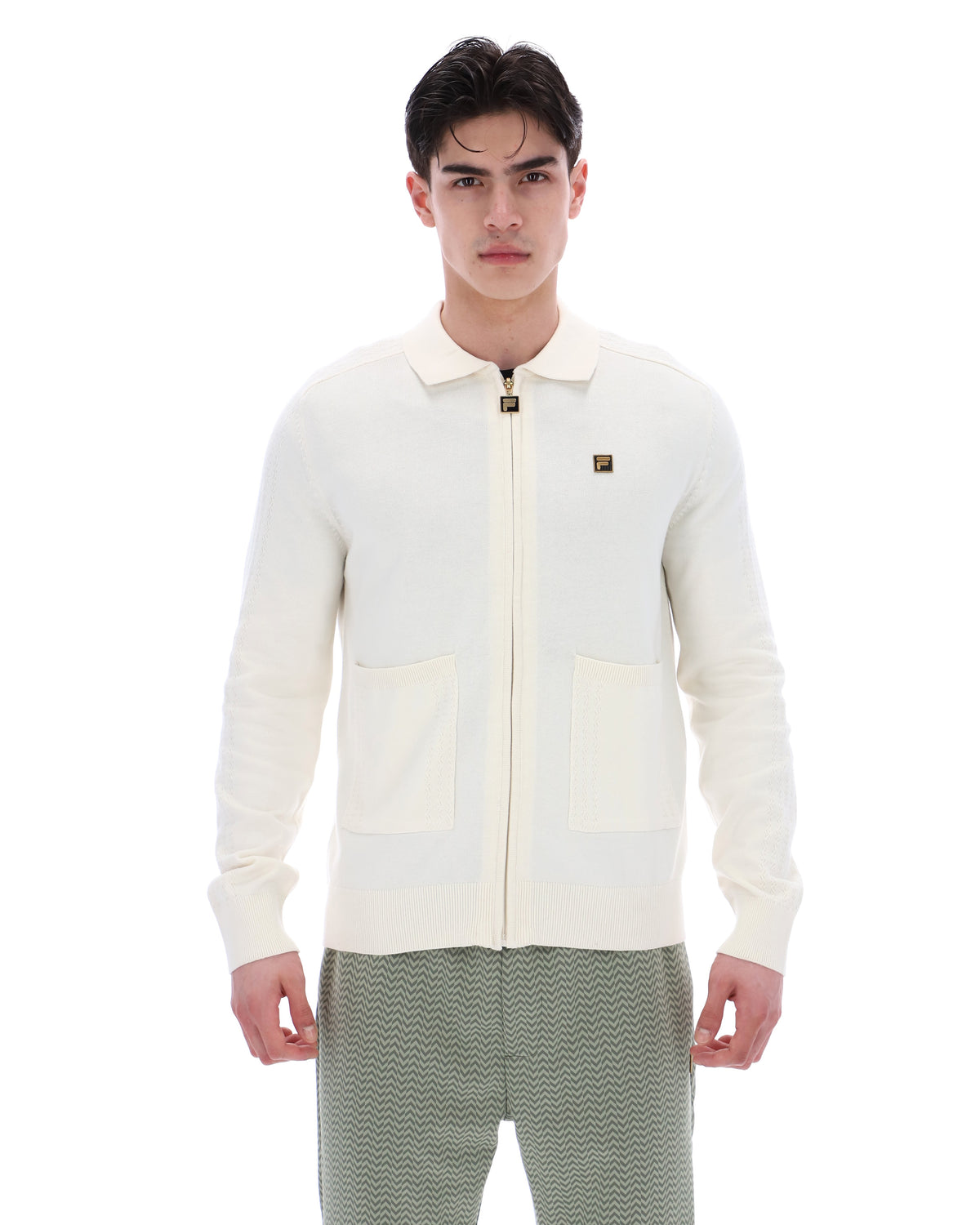 Displays a model wearing the Coconut Milk 'FILA' branded Teddy Knitted Shirt