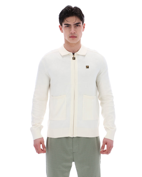 Displays a model wearing the Coconut Milk 'FILA' branded Teddy Knitted Shirt
