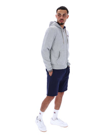 Man wearing a Grey Marl zip-through hoodie with a classic FILA logo on the chest on a white background