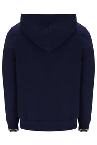 A male model wearing a navy blue zip-up hoodie with the FILA logo on the chest.