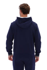 Displays a model wearing the 'Fila' branded Navy/ Gardenia Tenconi 2 Zip Thru Hoodie