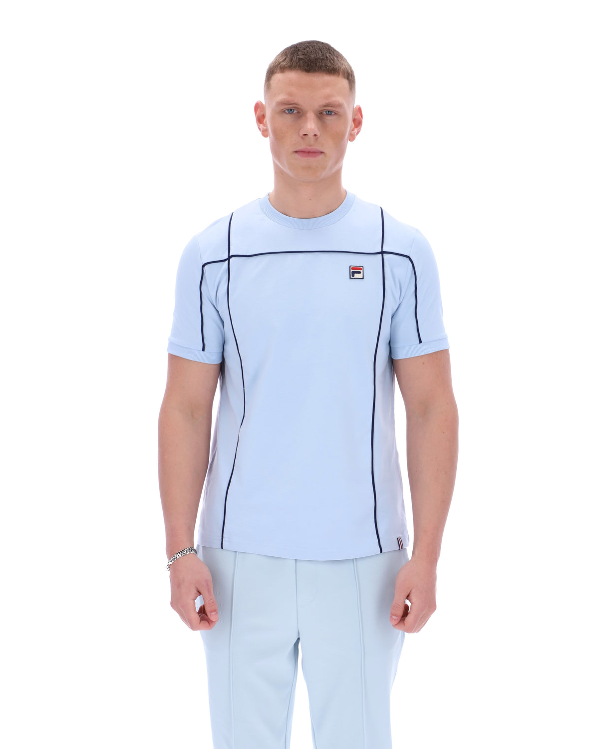 Displays a model wearing the Skyway 'FILA' branded Terri T-Shirt with Contrast Piping