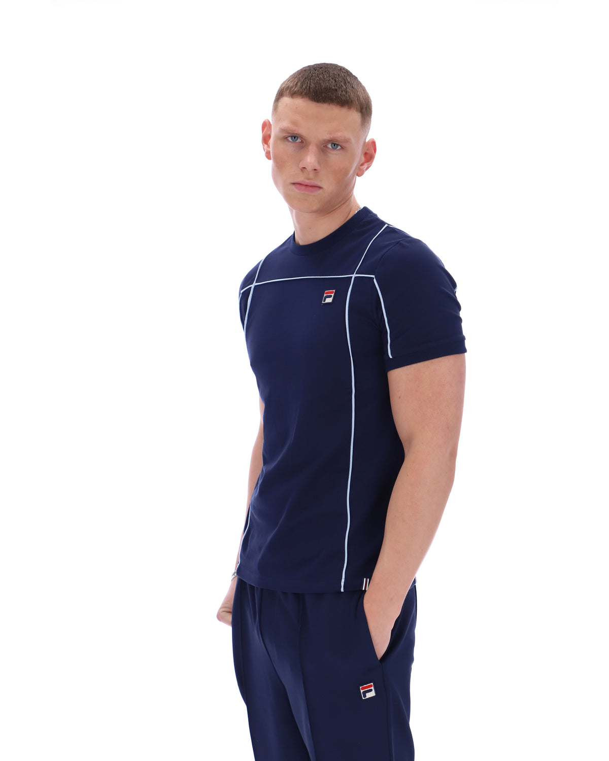 Displays a model wearing the Navy 'Fila' Terri T-Shirt with Contrast Piping