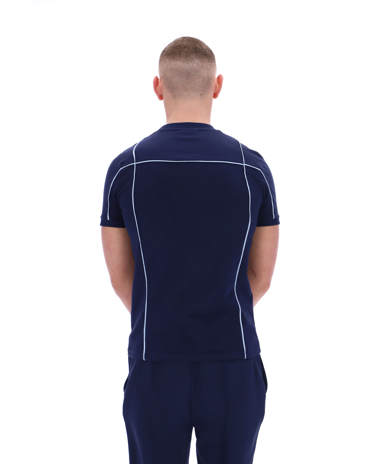 Displays a model wearing the Navy 'Fila' Terri T-Shirt with Contrast Piping