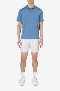 Displays a model wearing the Blue 'FILA' branded Tennis Essentials Top