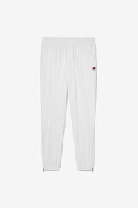 White tennis court track pants with the FILA logo on the left leg.