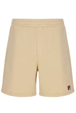 Beige shorts with a small logo on a white background
