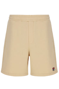 Beige shorts with a small logo on a white background