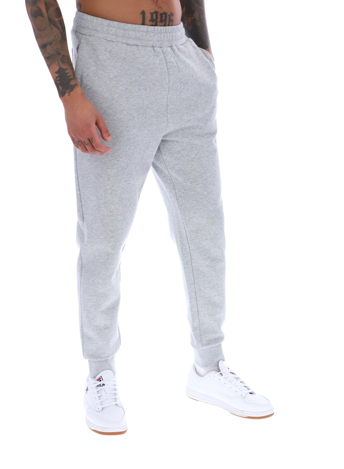 Displays a model wearing the Grey Marl 'FILA' branded Visconti Tipped Cuff Track Pant