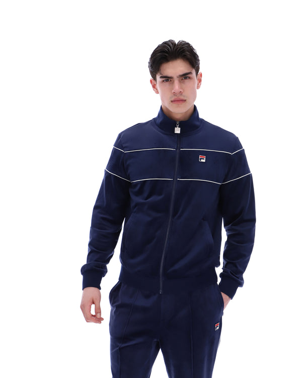 Displays a model wearing the Navy 'Fila' branded Vittorio Velour Track Top