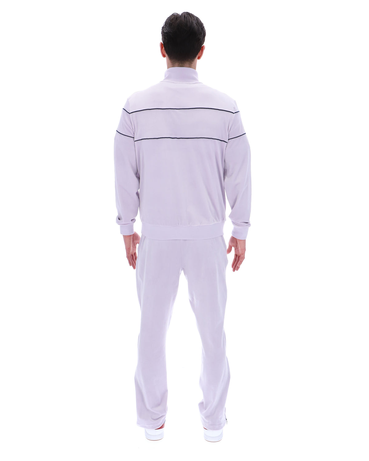 Displays a model wearing the Misty Lilac 'FILA' branded Vittorio Velour Track Top