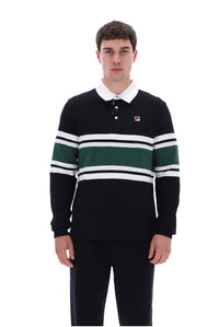 A man wearing a black long-sleeve rugby shirt with green and white horizontal stripes, a white collar, and a small Fila logo on the chest, paired with black pants, against a plain white background.