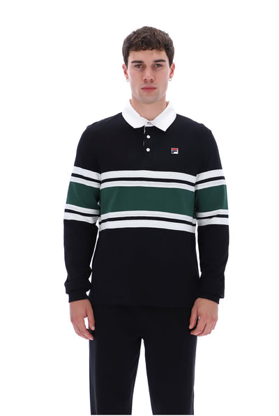 A man wearing a black long-sleeve rugby shirt with green and white horizontal stripes, a white collar, and a small Fila logo on the chest, paired with black pants, against a plain white background.