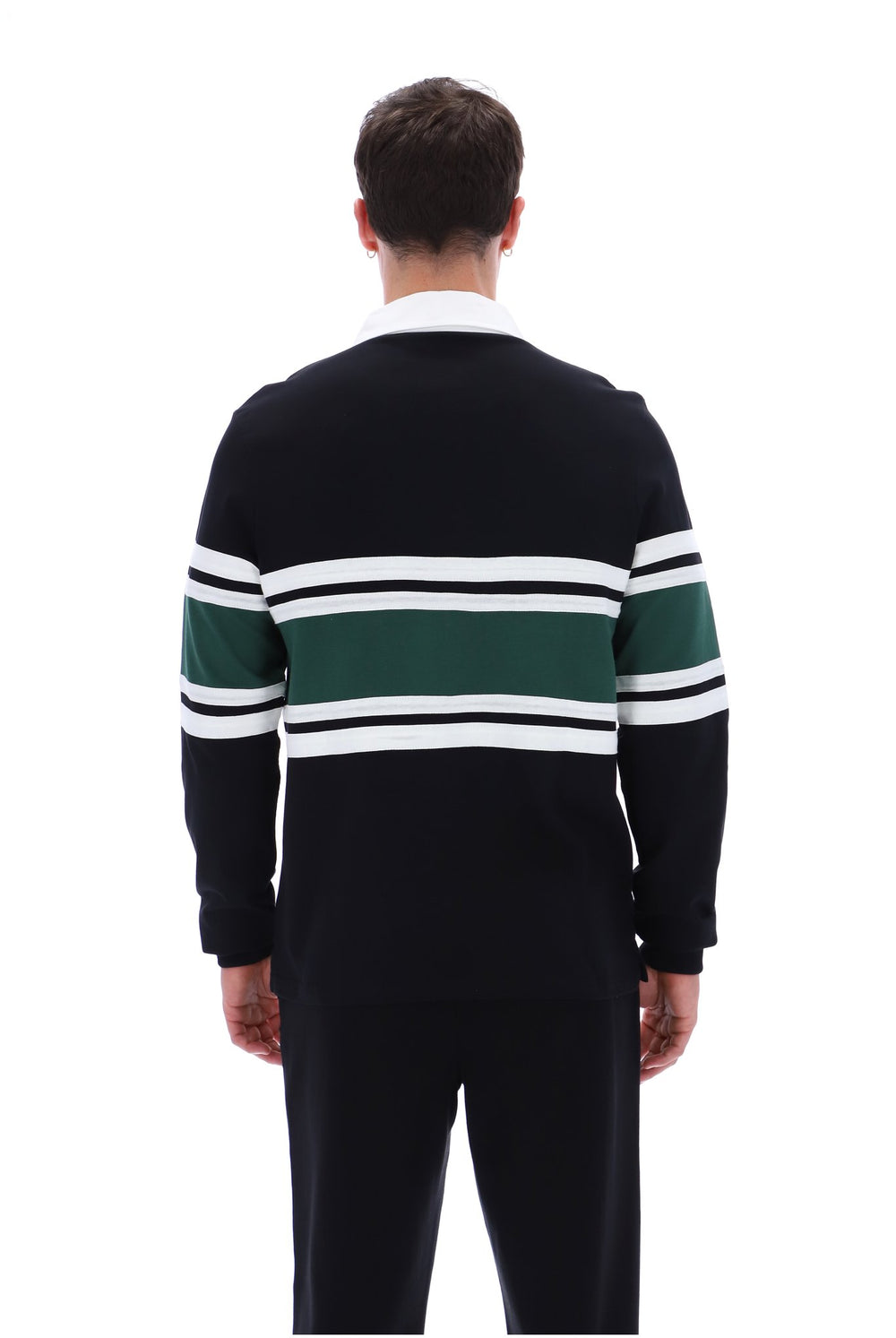 A man viewed from the back wearing a dark navy long-sleeve knit sweater with horizontal green and white stripes across the chest and sleeves, paired with dark trousers, on a plain white background.