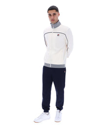 Displays a model wearing the Gardenia 'FILA' branded Zayn Track Top